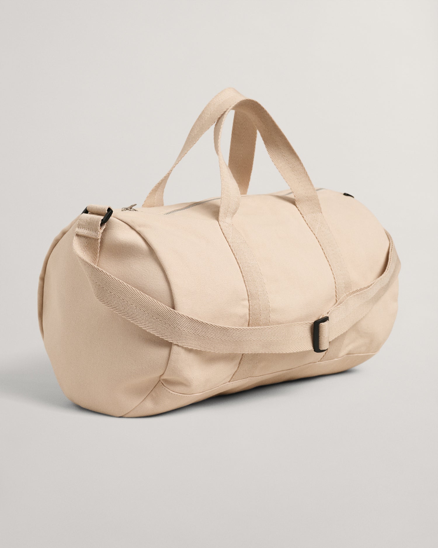 UNISEX. D1. ARCHIVE SHIELD DUFFLE-PUTTY